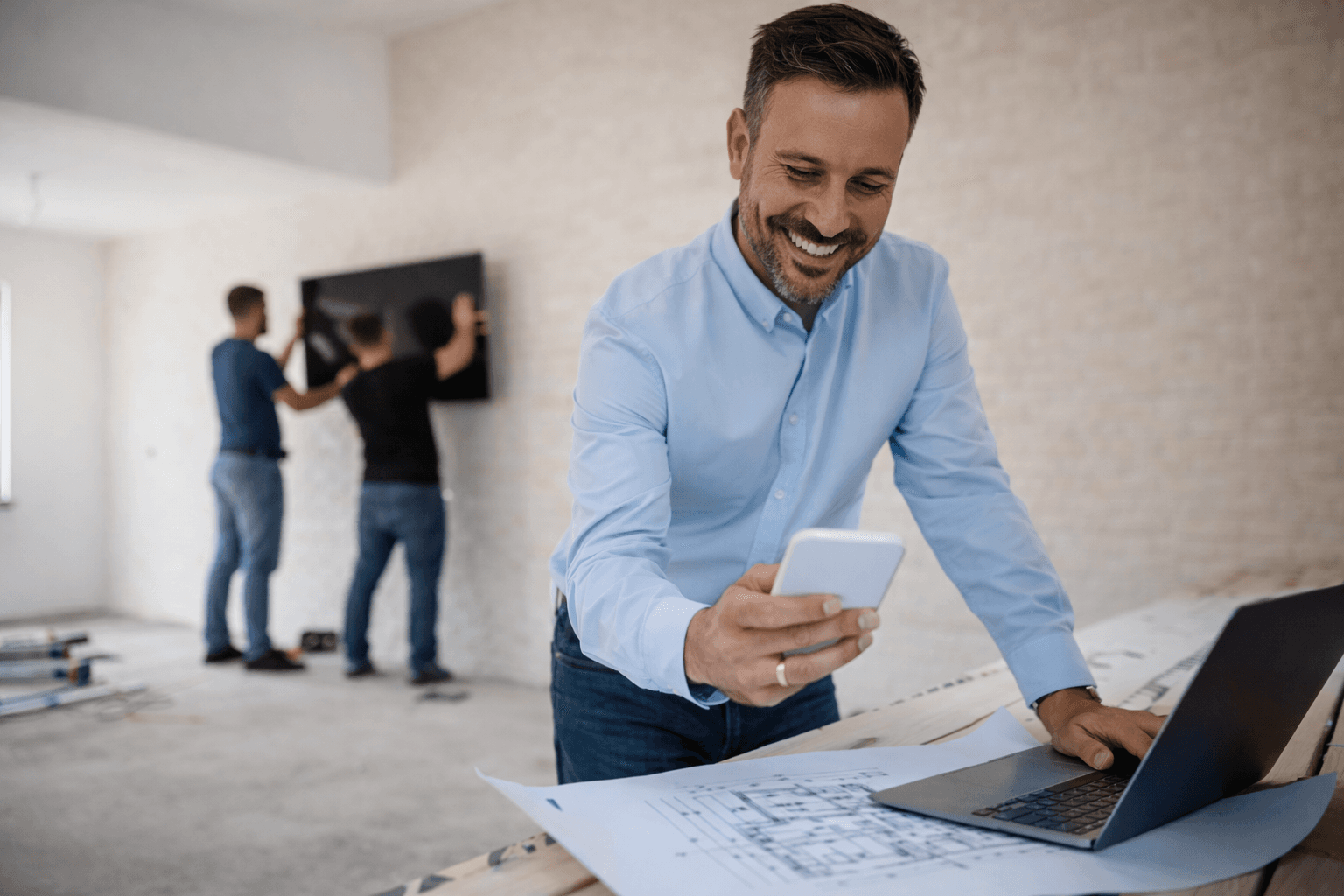 Guy on site with phone